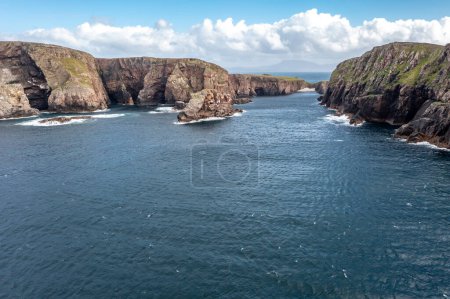 The cliffs and sea stacks at Port Challa on Tory Island, County Donegal, Ireland.