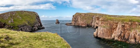 The cliffs and sea stacks at Port Challa on Tory Island, County Donegal, Ireland.