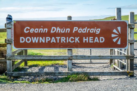 Photo for BALLYCASTLE,COUNTY MAYO, REPUBLIC OF IRELAND - JULY 15 2022 : Sign explaining Downpatrick Head. - Royalty Free Image