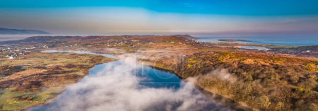 Photo for Aerial view of Lough fad in the morning fog, County Donegal, Republic of Ireland. - Royalty Free Image
