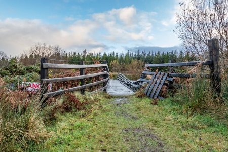 Photo for An old, rotten wooden bridge over the Owenea river by Ardara in County Donegal - Ireland. - Royalty Free Image