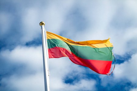 Photo for Lithuania flag waving in the wind. Cloudy sky - Royalty Free Image