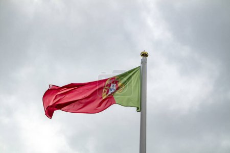 Foto de National fag of Portugal waving in the wind. - Imagen libre de derechos