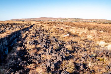 Photo for Peat Turf cutting in County Donegal - Ireland. - Royalty Free Image