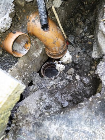 Photo for Broken pipes due to subsidence of building on a peatbog. - Royalty Free Image