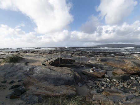 The rocks of Carrickfad by Portnoo at Narin Strand in County Donegal Ireland.