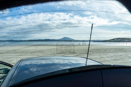Photo for The beach in Downings seen through boot window of car, County Donegal, Ireland. - Royalty Free Image