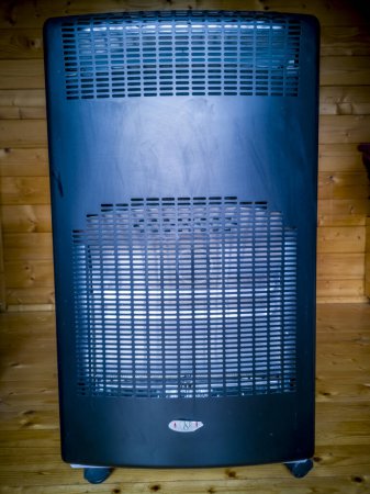 Photo for MOERS, GERMANY - JULY 10 2019 : Gas bottle standing in gas heater. - Royalty Free Image