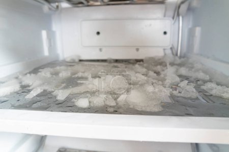 Photo for Ice in the freezer, Defrosting of the fridge and freezer. - Royalty Free Image