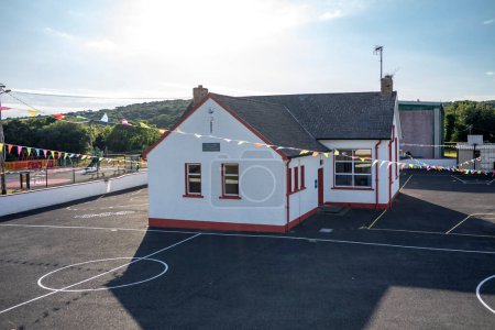 Photo for BRUCKLESS, IRELAND - MAY 16 2023: The National School is next to the church. - Royalty Free Image