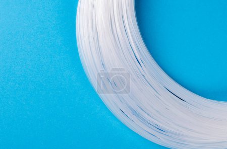 Photo for Fishing line on blue background - Royalty Free Image