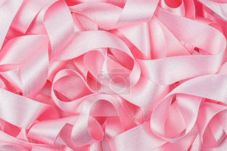 Photo for Abstract pink curly satin ribbon background - Royalty Free Image