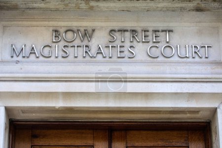 Sign above the entrance to the historic Bow Street Magistrates Court building in London, UK.  The building is now a hotel.