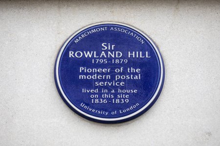 Photo for London, UK - February 5th 2024: Blue plaque on the exterior of a building on Cartwright Gardens in London, UK, marking the location where Sir Rowland Hill ived. - Royalty Free Image