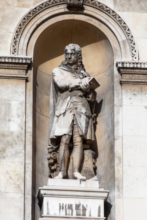 Photo for London, UK - February 26th 2024: Statue of famous architect Sir Christopher Wren, on the exterior of Burlington House which is home to the Royal Academy of Art in London, UK. - Royalty Free Image
