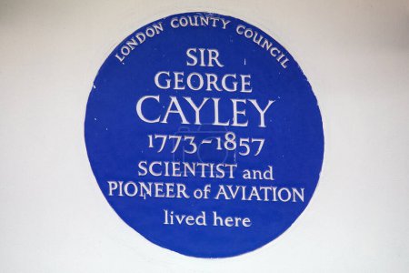 Photo for London, UK - February 26th 2024: A blue plaque on Hertford Street in Mayfair, London, marking where scientist and pioneer of aviation Sir George Cayley lived. - Royalty Free Image
