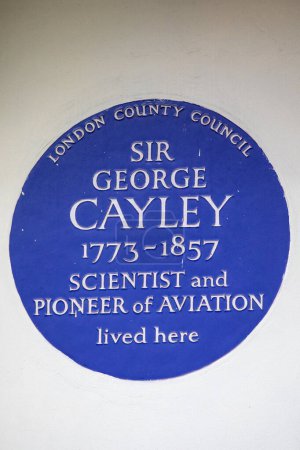 Photo for London, UK - February 26th 2024: A blue plaque on Hertford Street in Mayfair, London, marking where scientist and pioneer of aviation Sir George Cayley lived. - Royalty Free Image