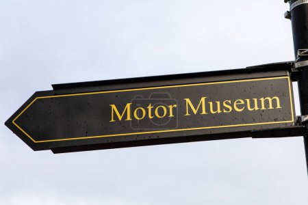 Signpost for the Motor Museum in the village of Bourton-on-the-Water in the Cotswolds, UK.