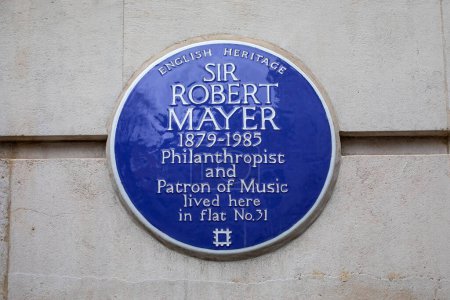 Photo for London, UK - March 18th 2024: A blue plaque on Mansfield Street in London, UK, marking the location where philanthropist Sir Robert Mayer lived. - Royalty Free Image