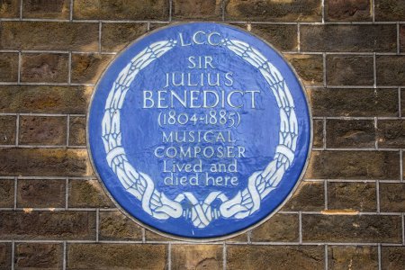Photo for London, UK - March 18th 2024: A blue plaque on Manchester Square in London, marking where musical composer Sir Julius Benedict lived and died. - Royalty Free Image