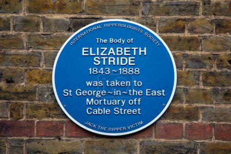 Photo for London, UK - April 3rd 2024: A blue plaque on Cable Street in London, UK, marking where the body of Jack the Ripper victim Elizabeth Stride was taken from to the mortuary in 1888. - Royalty Free Image