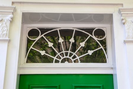 Close-up of a beautiful fanlight above a doorway in London, UK.