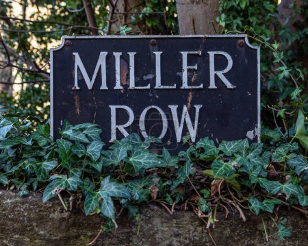 Street sign for Miller Row in the historic Dean Village in Edinburgh, Scotland.
