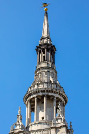 Photo for The magnificent spire of St. Mary-le-Bow church, topped with a gold Dragon sculpture, in the City of London, UK. - Royalty Free Image