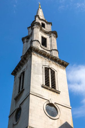 The tower and spire of St. Vedast-alias-Foster church, also known as St. Vedast Foster Lane, located in the City of London, UK.