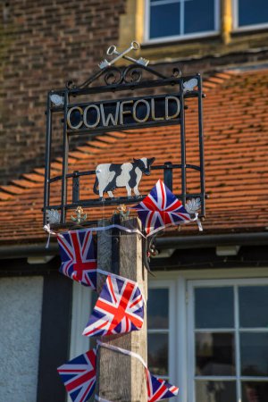 A vintage sign in the beautiful village of Cowfold in West Sussex, UK.