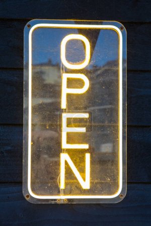 Close-up of a neon OPEN sign.