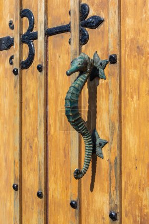 Close-up of a Seahorse door knocker on the Isle of Wight in the UK.