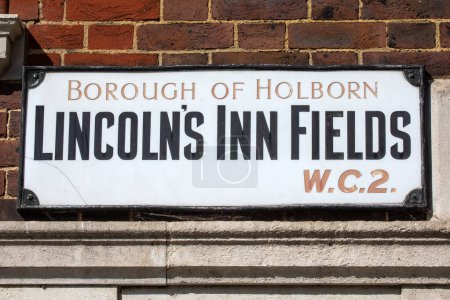 Close-up of a street sign for Lincoln's Inn Fields, located in the Holborn area of London, UK.
