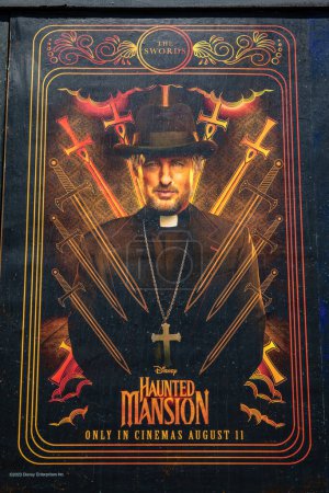 Photo for London, UK - August 9th 2023: A movie poster for the Disney movie Haunted Mansion on display in the Bethnal Green area of London, UK. - Royalty Free Image