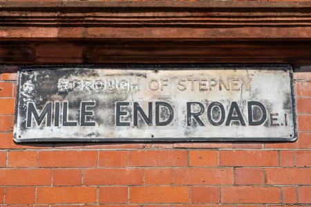 Close-up of a street sign for Mile End Road in London, UK.