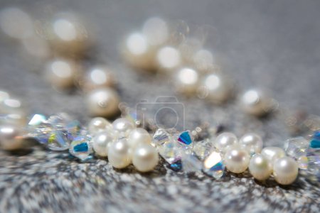 Photo for This captivating image showcases a creative and artistic photograph of bridal accessories, including earrings, shoes, garters, jewelry, and perfume. The photograph is a beautiful composition of various elements, highlighting the intricate details of - Royalty Free Image