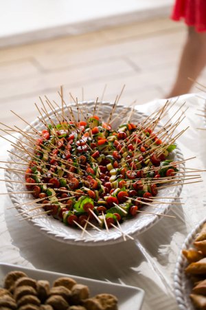 Photo for This stunning image showcases a creative and beautifully composed photograph of food, canapes, and desserts served at weddings. The photograph is a feast for the eyes, featuring mouth-watering dishes with vibrant colors and textures. The image is per - Royalty Free Image