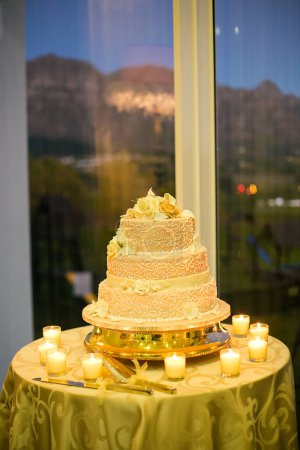 Photo for This image showcases a variety of stunning wedding cakes, ranging from tiered cakes to cup cakes. The photograph features an array of delicious cakes, each meticulously decorated with intricate details and delicate frosting. The cakes come in a varie - Royalty Free Image