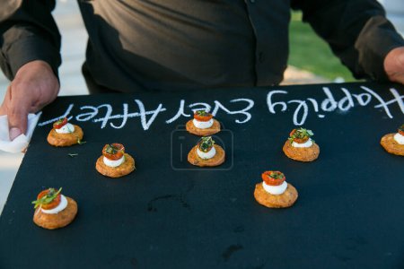 Photo for This stunning image showcases a creative and beautifully composed photograph of food, canapes, and desserts served at weddings. The photograph is a feast for the eyes, featuring mouth-watering dishes with vibrant colors and textures. The image is per - Royalty Free Image