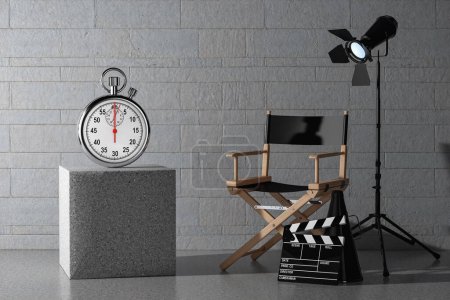 Photo for Stopwatch with Blank Screen near Director Chair, Movie Clapper and Spotlight in front of stone blocks wall background. 3d Rendering - Royalty Free Image