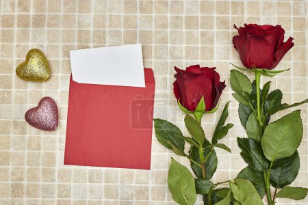 Photo for Beautiful roses flowers with a blank card for valentine and hearts glitters toys - Royalty Free Image