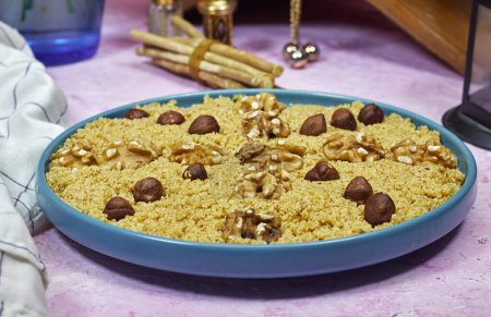 tamina is the name of algerian food is base with semolina and honey, this is a tradition sweet food for mawlid or ramadan
