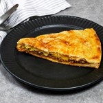 homemade slice Meat Pie made from meat and cheese and egg
