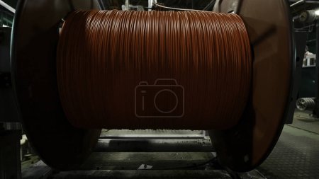 Spinning coil with copper cable close-up. Creative. Industrial background with a workshop