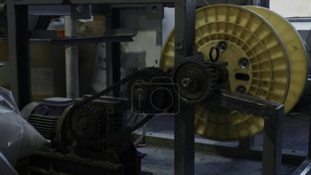 A mechanism with rotating gears. Creative. Industrial background at the workshop