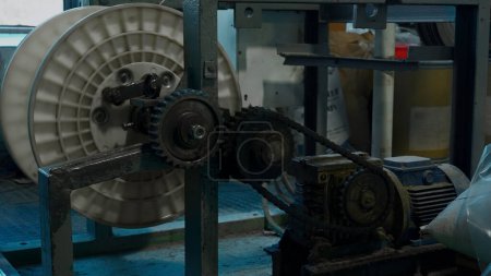 A mechanism with rotating gears. Creative. Industrial background at the workshop