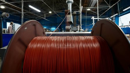 Cable production workshop and large coil. Creative. Modern cable manufacturing factory details