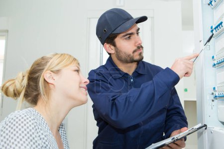 male technician and woman having conversation