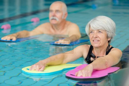 senior people in aquatic fitness class