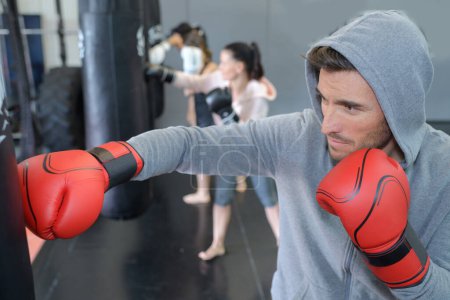 people in boxing training class